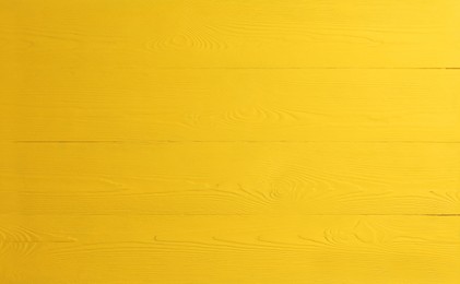 Image of Texture of yellow wooden surface as background, banner design