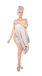 Photo of Full length portrait of young pretty woman with towels on white background