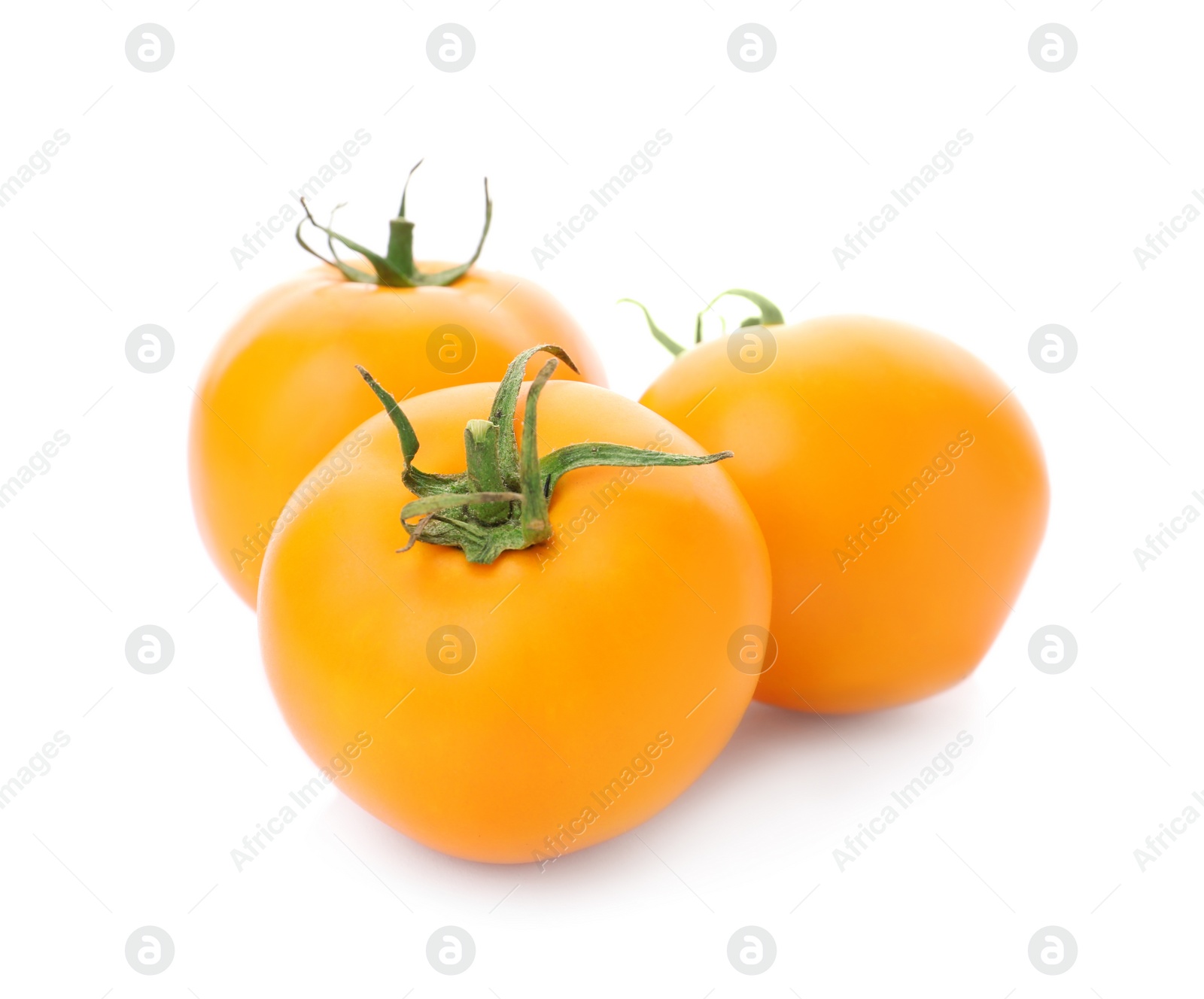 Photo of Delicious ripe orange tomatoes on white background