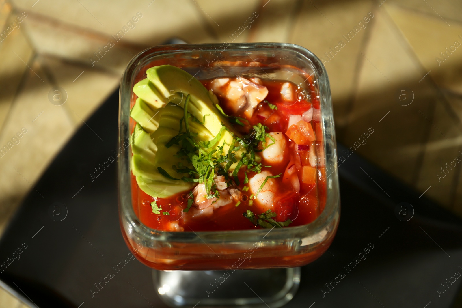 Photo of Delicious campechana cocktail on table, above view