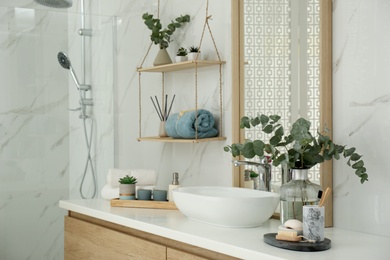 Photo of Modern bathroom interior with stylish mirror and vessel sink