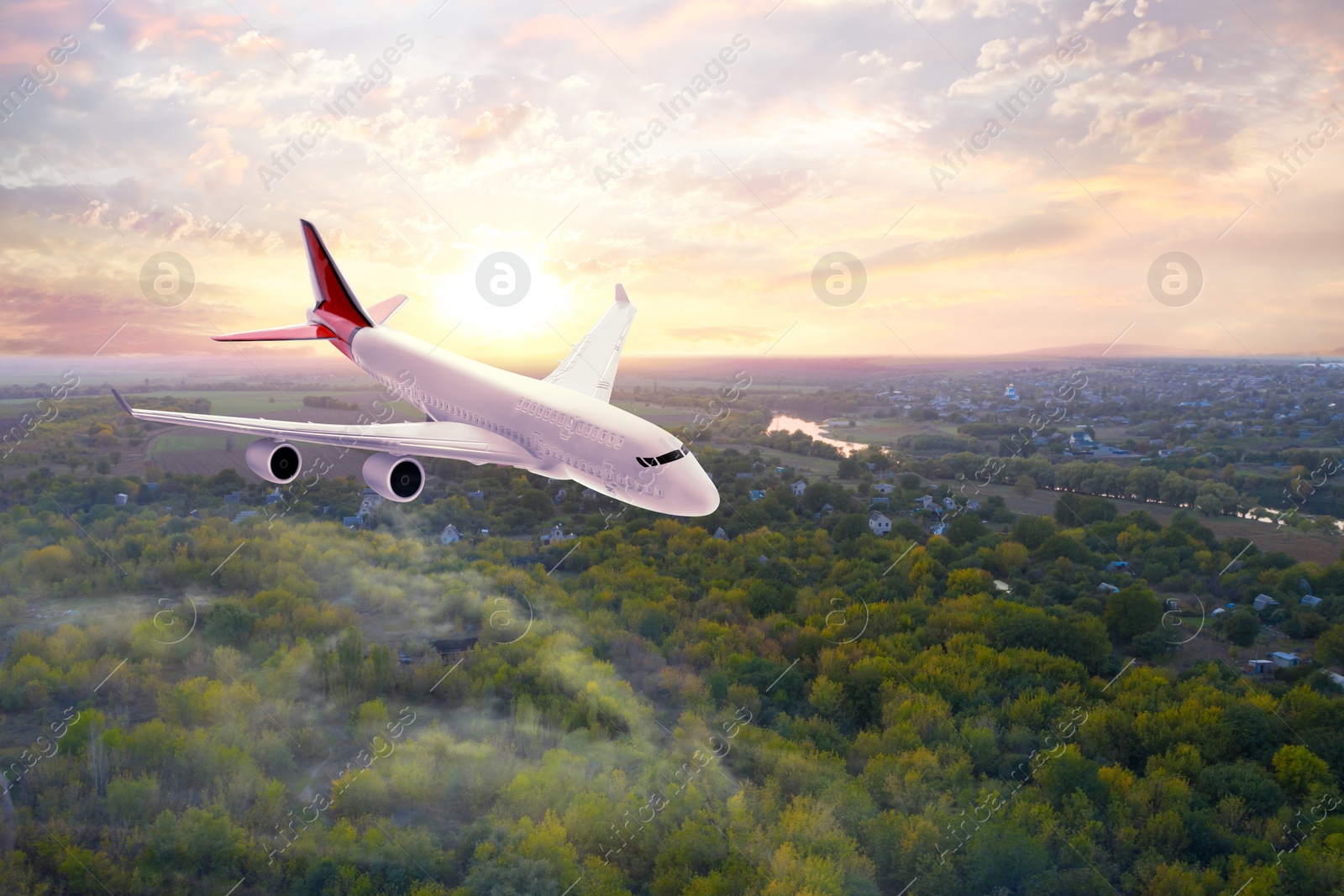 Image of Modern airplane flying in cloudy sky over wood