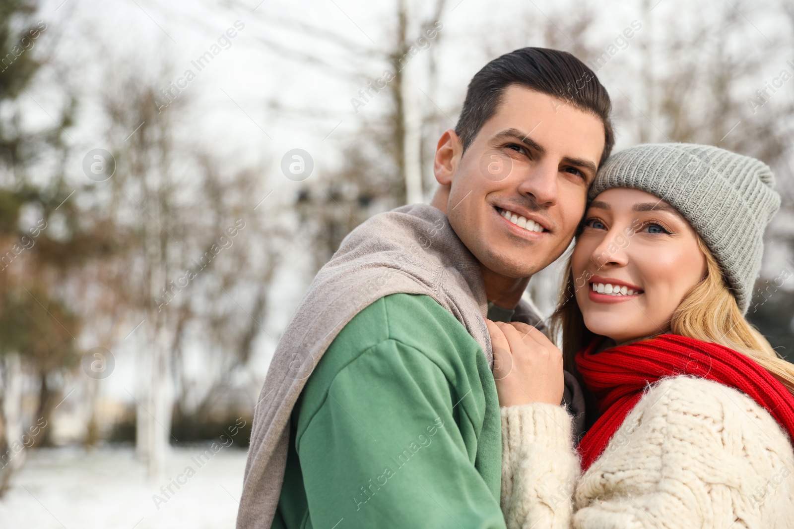 Photo of Beautiful happy couple outdoors on winter day