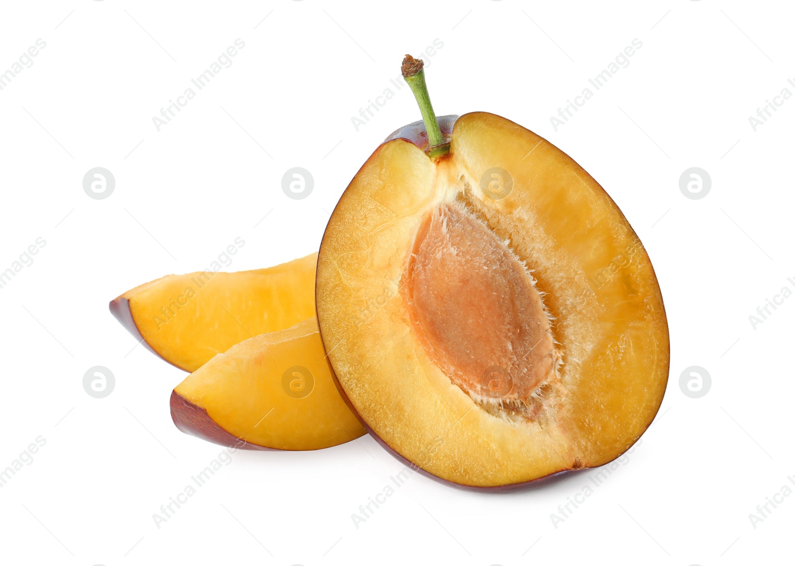 Photo of Pieces of fresh ripe plum on white background