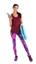 Photo of Beautiful young woman in sportswear with towel and bottle of water on white background