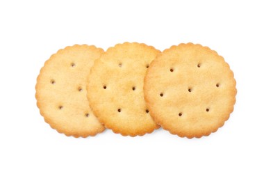 Photo of Three crispy crackers isolated on white, top view. Delicious snack