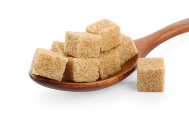 Photo of Brown sugar cubes and wooden spoon isolated on white, closeup