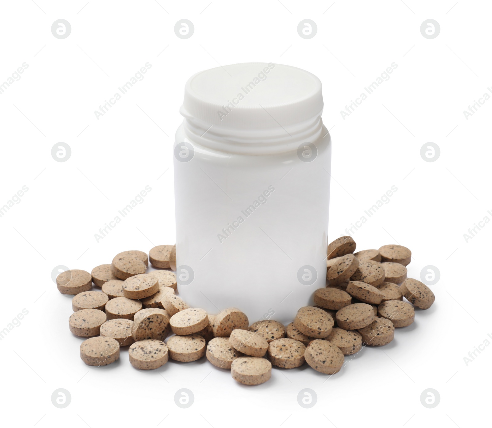 Photo of Vitamin pills and bottle isolated on white