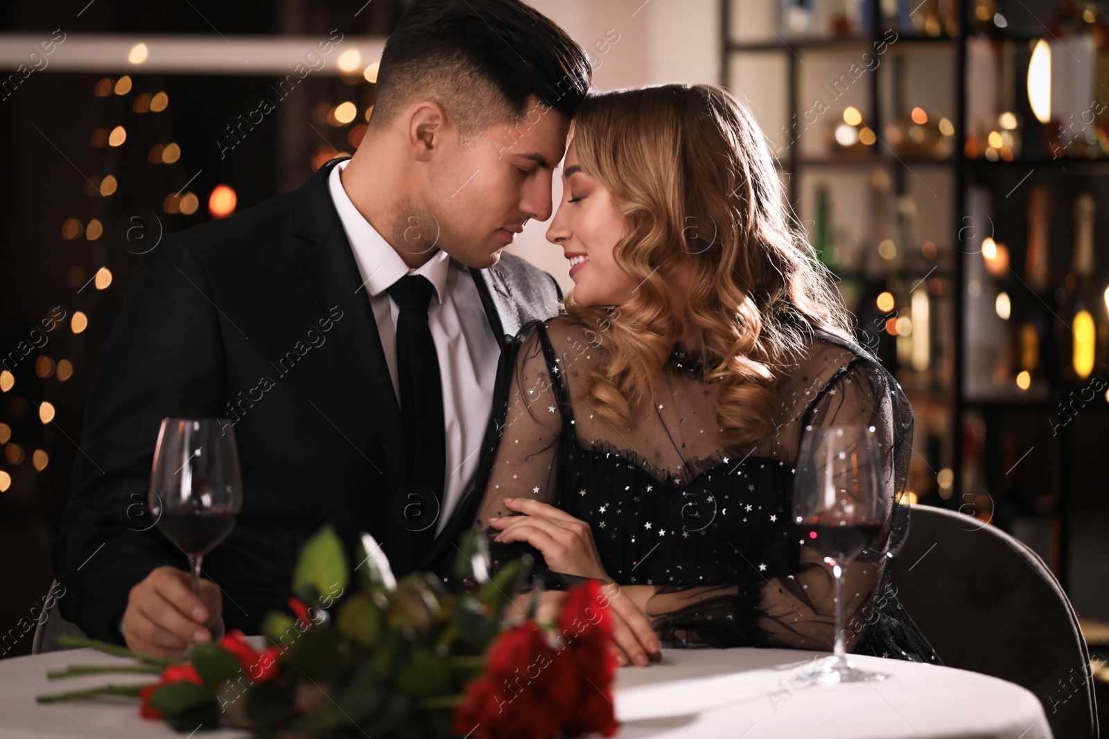 Photo of Lovely couple having romantic dinner on Valentine's day in restaurant