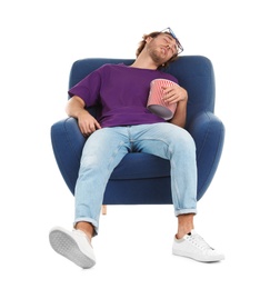 Photo of Man with 3D glasses and popcorn sleeping in armchair during cinema show on white background