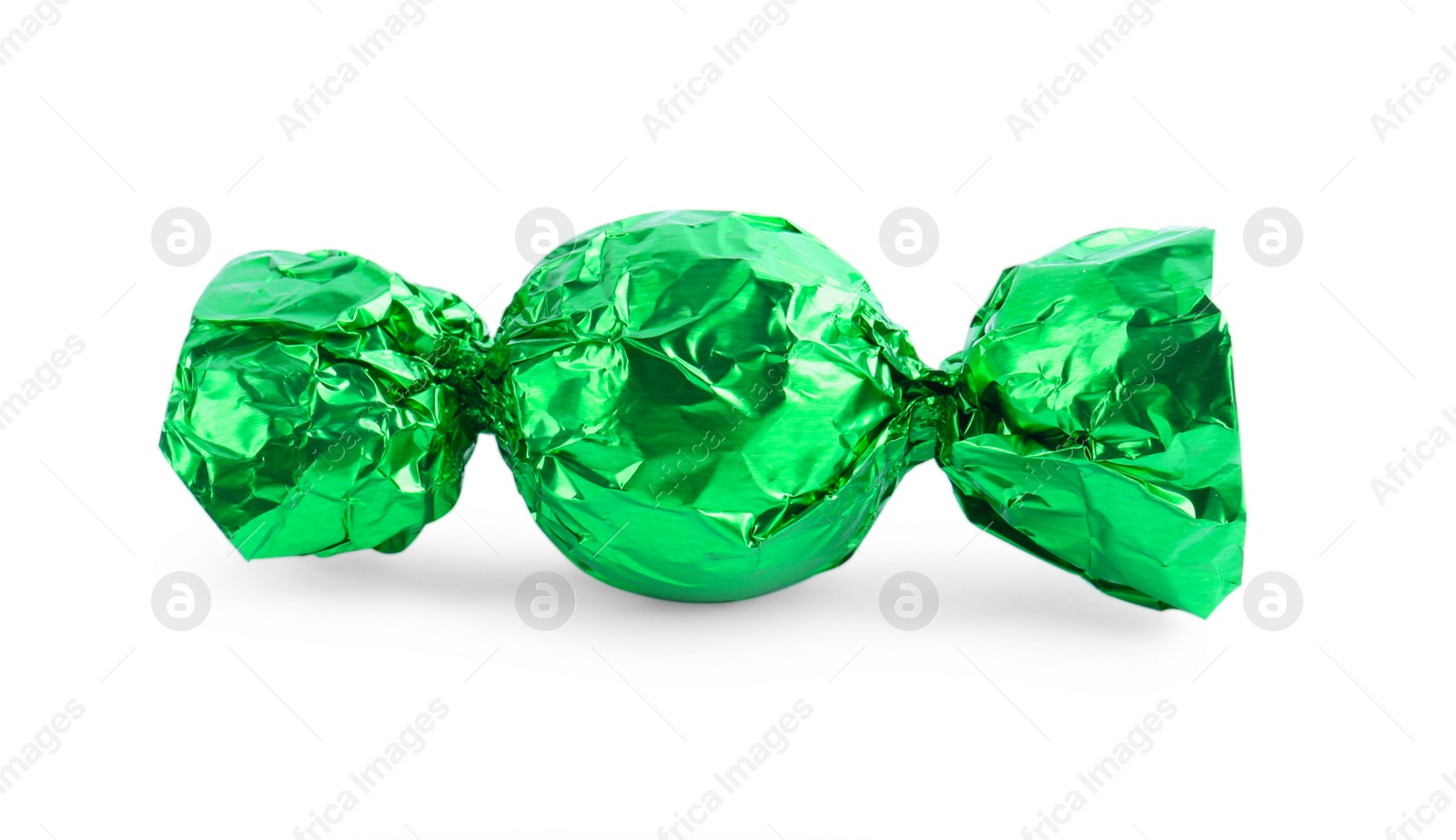 Photo of Tasty candy in green wrapper isolated on white