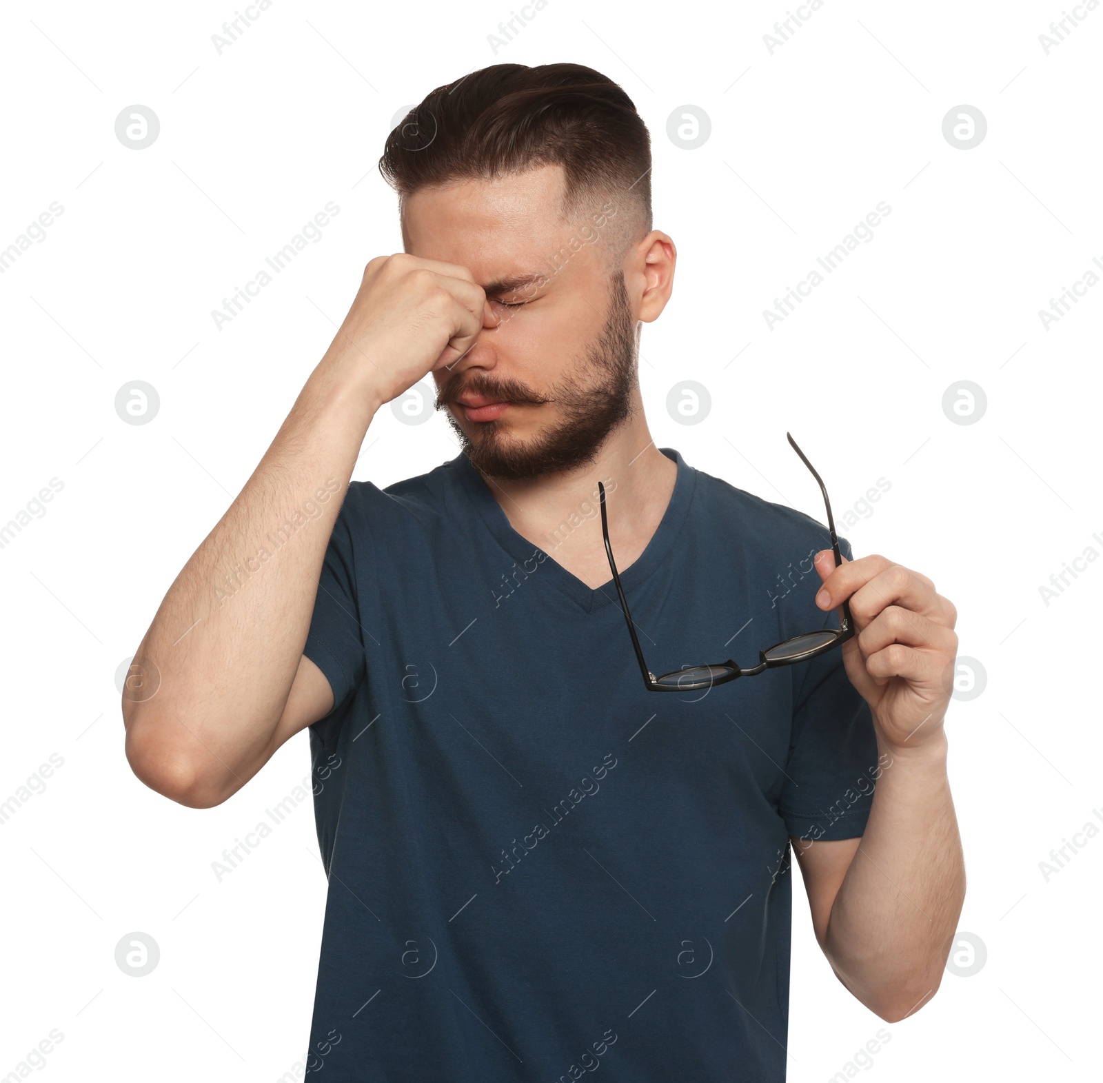 Photo of Young man suffering from eyestrain on white background