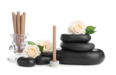 Photo of Aromatic incense sticks, roses and spa stones on white background