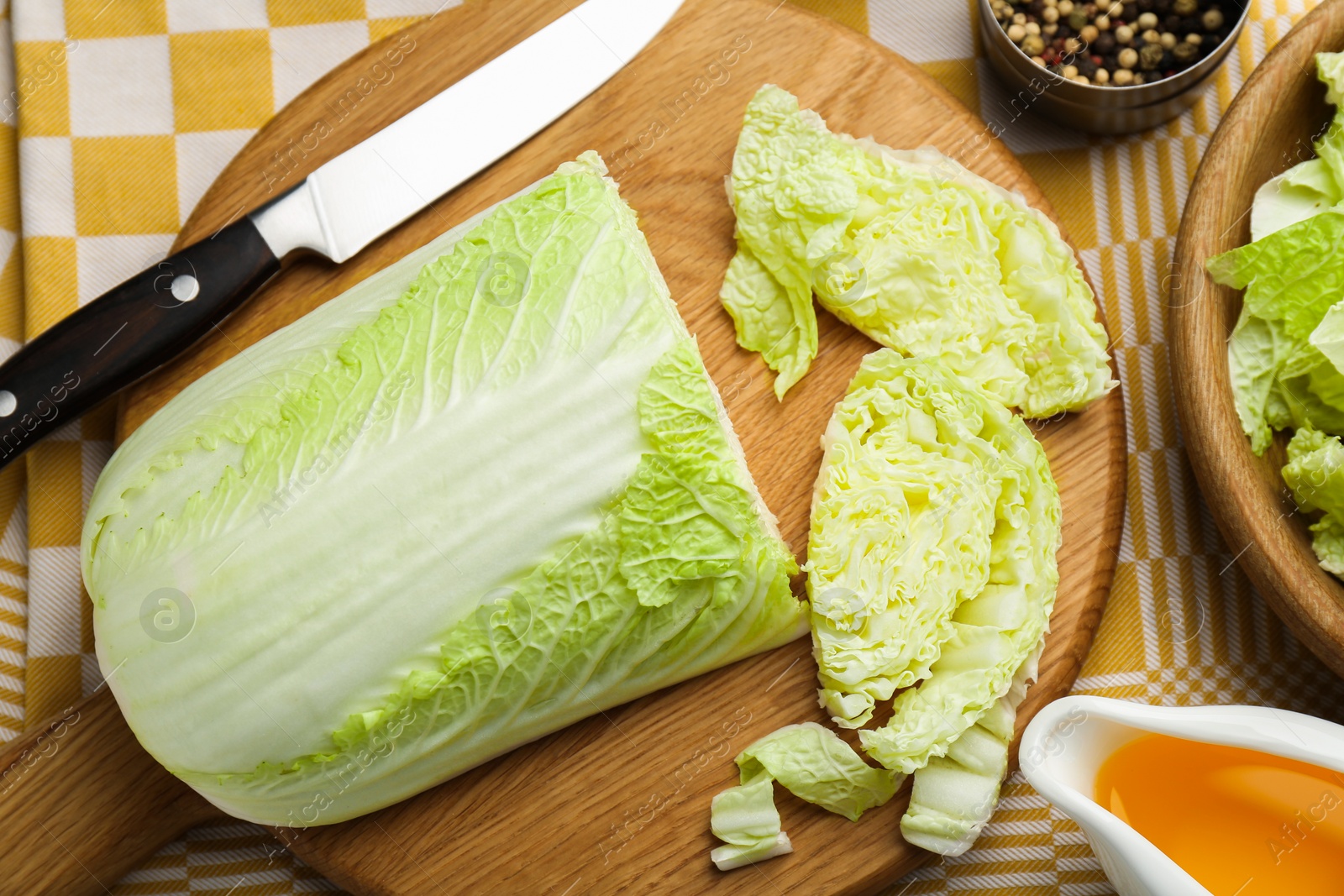 Photo of Cut fresh Chinese cabbage, oil and spices on table, flat lay