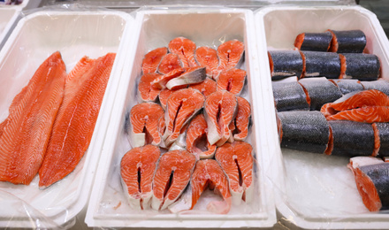 Photo of Fresh fish on display with ice at wholesale market