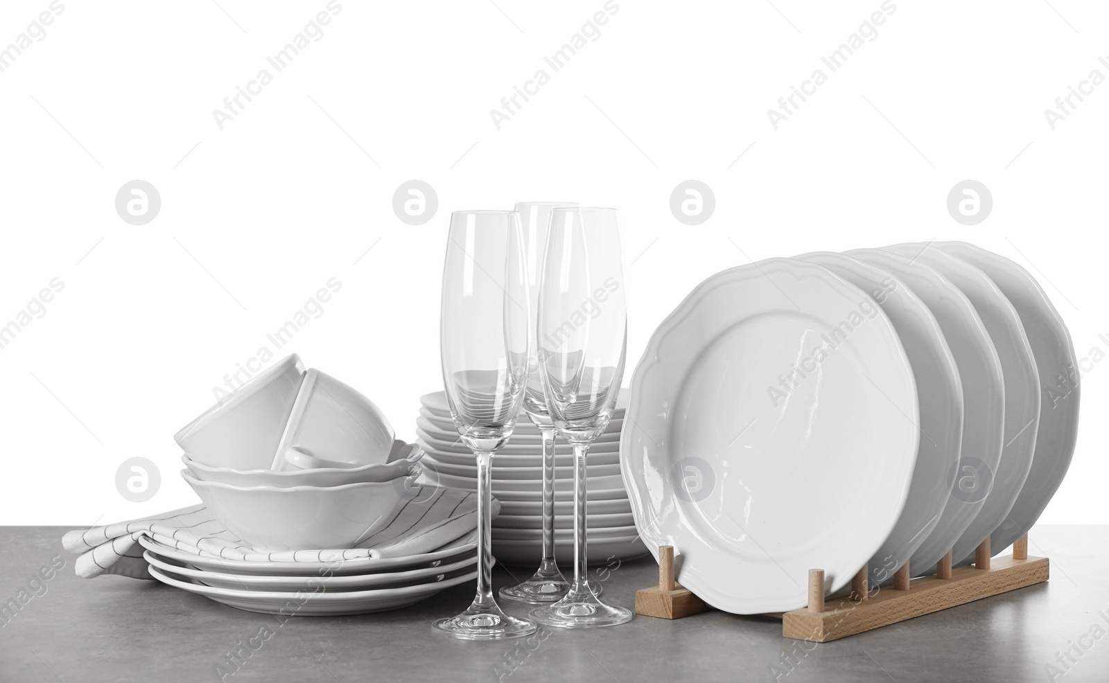 Photo of Set of clean dishes on white background