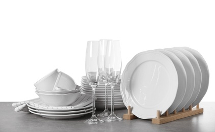 Photo of Set of clean dishes on white background