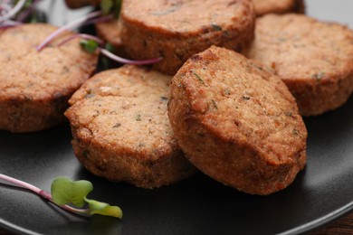 Photo of Delicious vegan cutlets on plate, closeup view