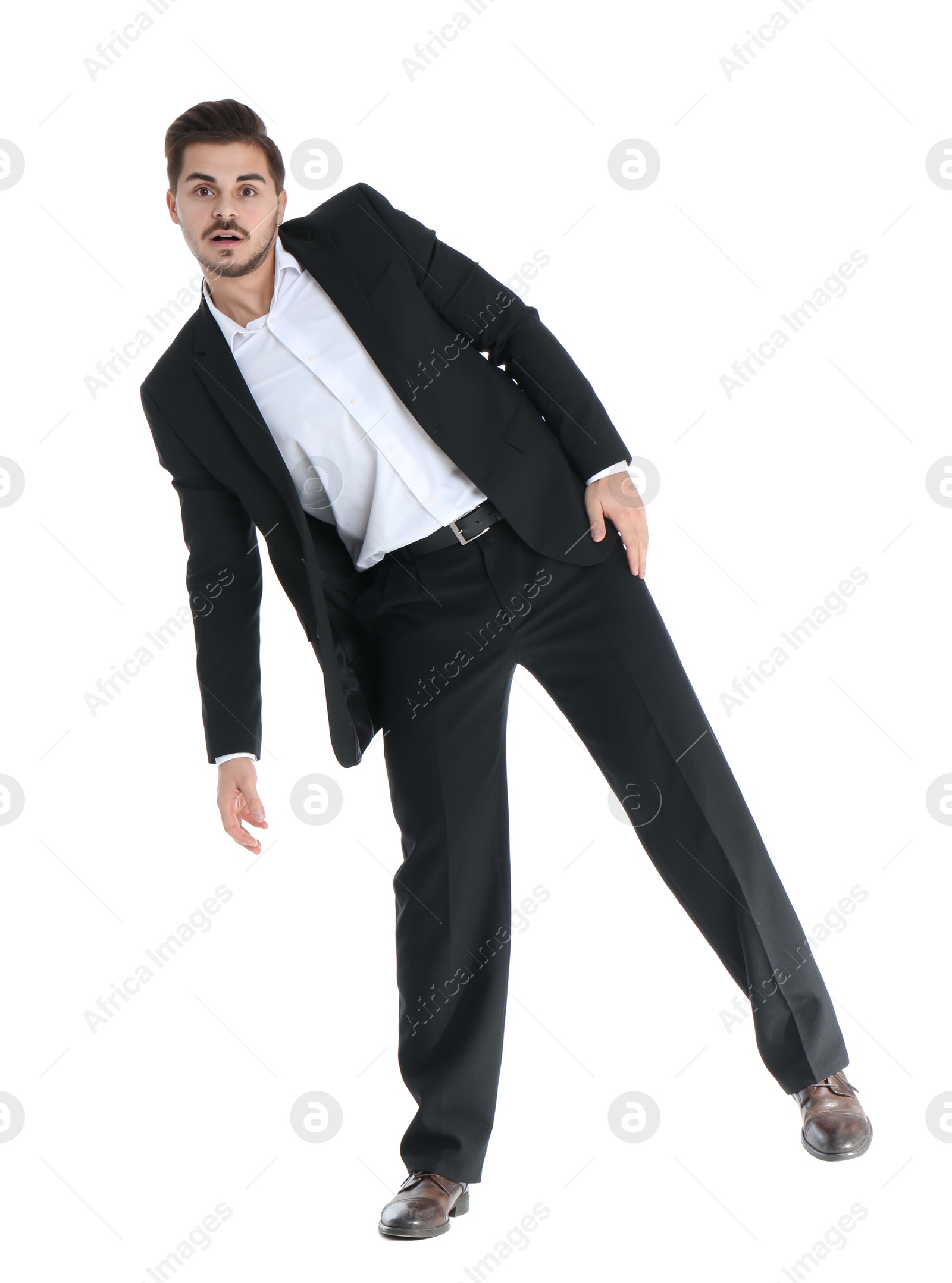 Photo of Young businessman attracted to magnet on white background