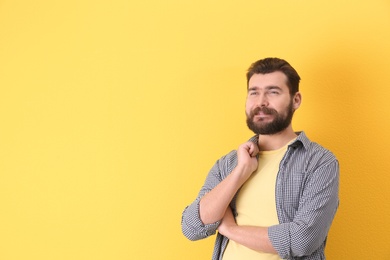 Photo of Portrait of confident mature man on color background