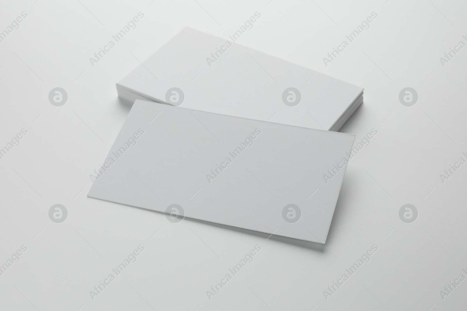 Photo of Blank business cards on white background. Mockup for design