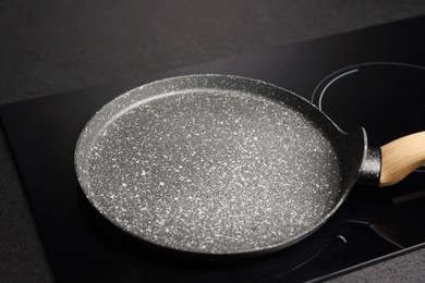 Photo of Nonstick frying pan on stove in kitchen