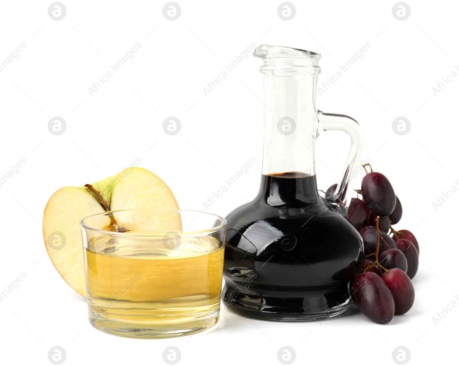 Photo of Different types of vinegar and ingredients isolated on white