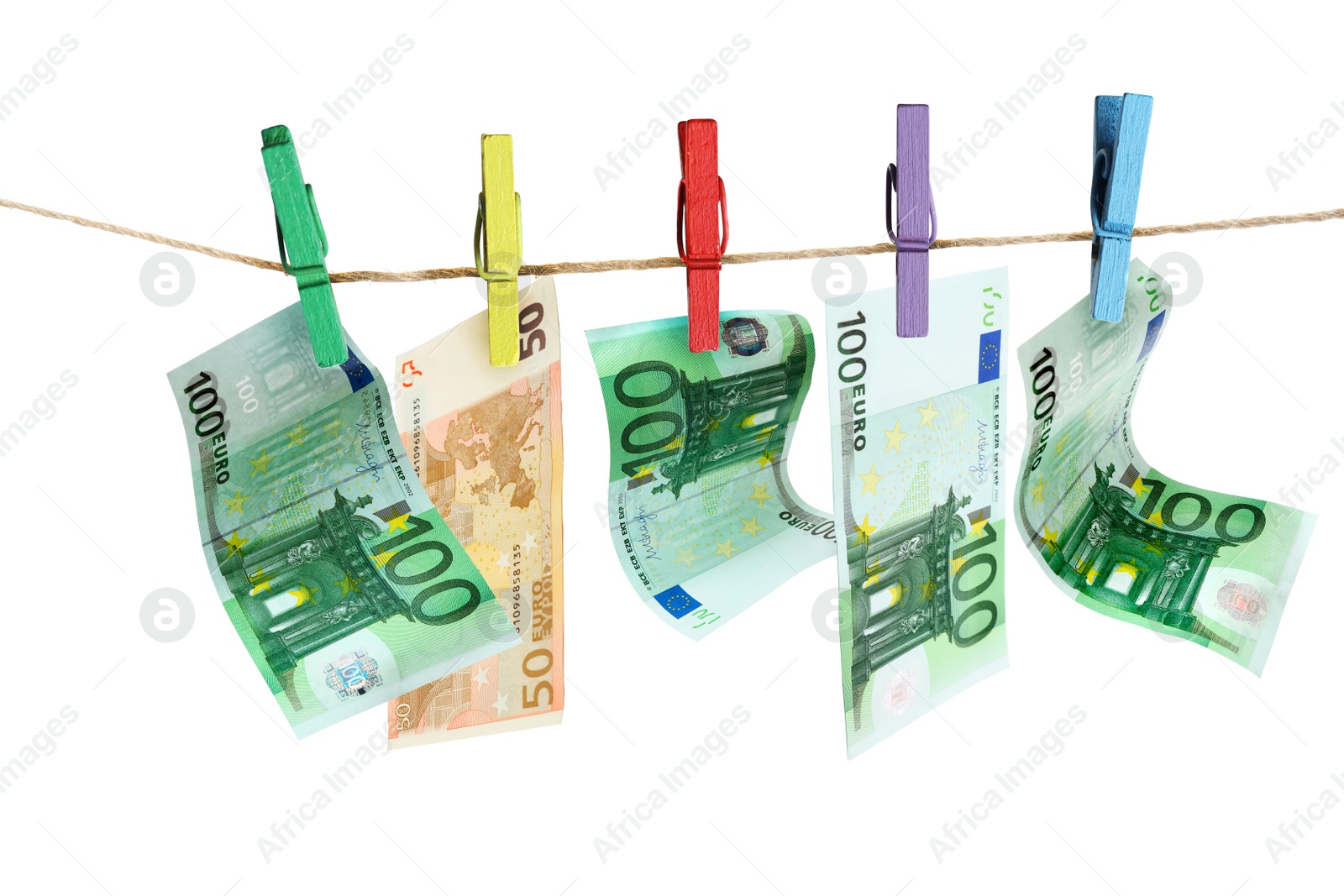 Image of Money laundering. Euro banknotes hanging on clothesline against white background