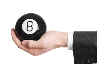 Man holding magic eight ball on white background, closeup