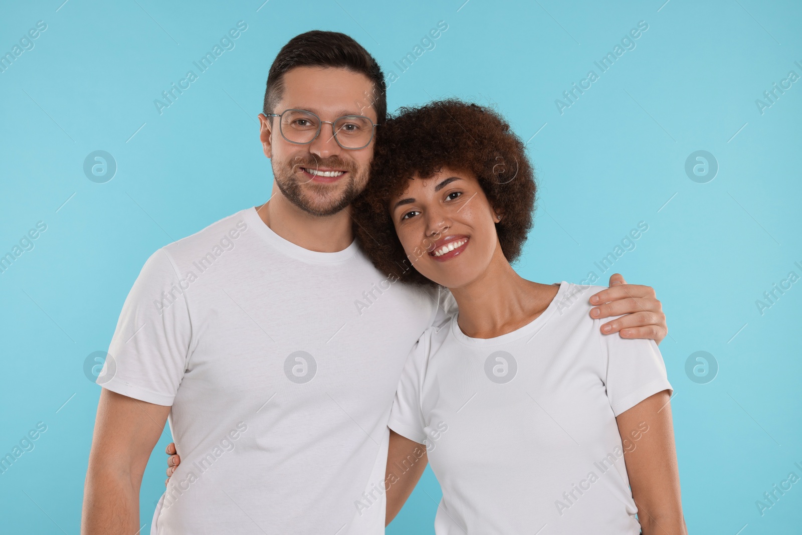 Photo of International dating. Portrait of happy couple on light blue background