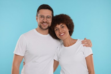 Photo of International dating. Portraithappy couple on light blue background