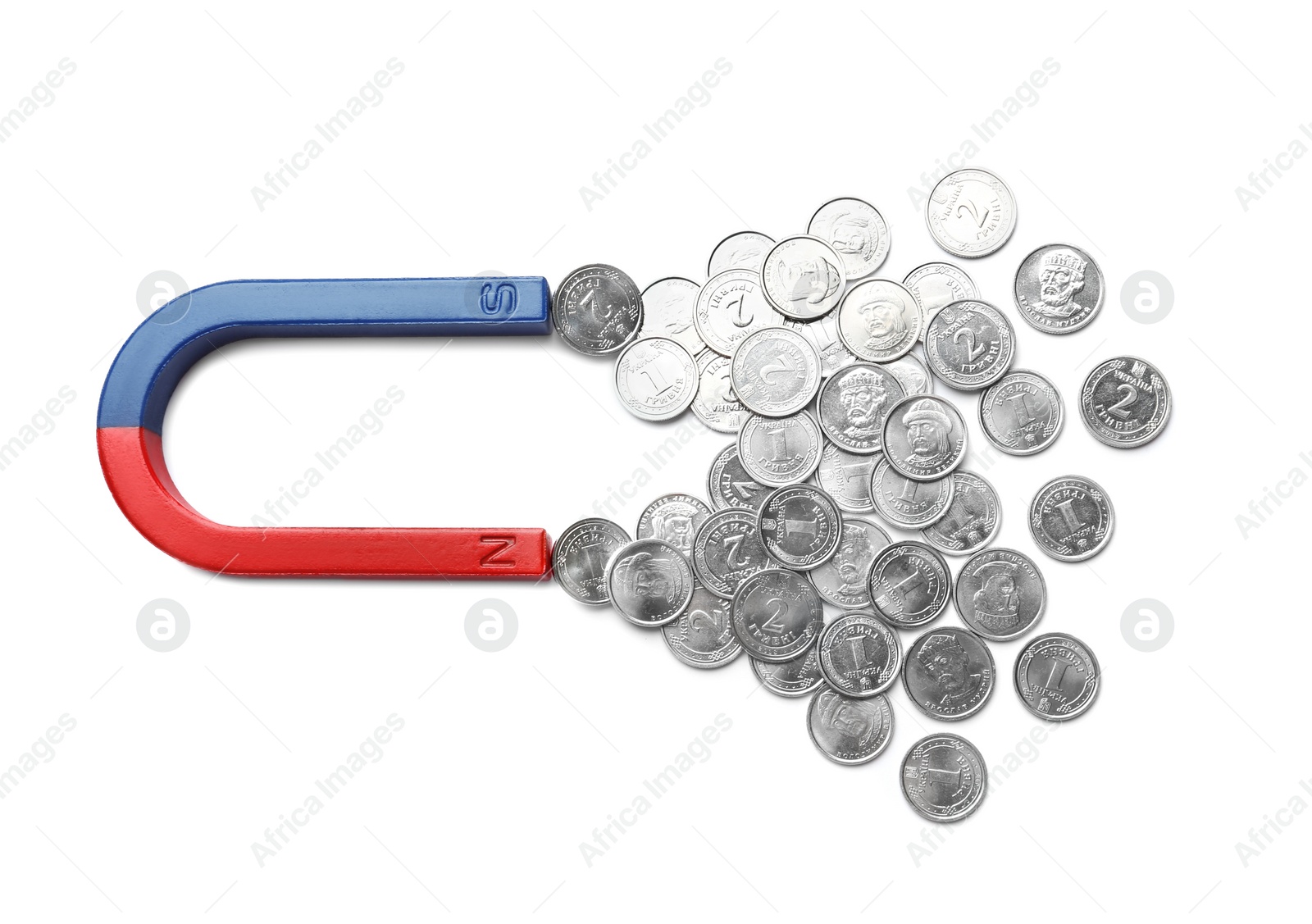 Photo of Magnet attracting coins on white background, top view. Business concept