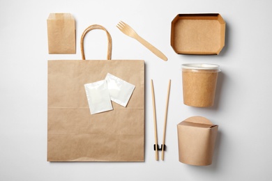 Photo of Different containers for mock up design on white background, flat lay. Food delivery service