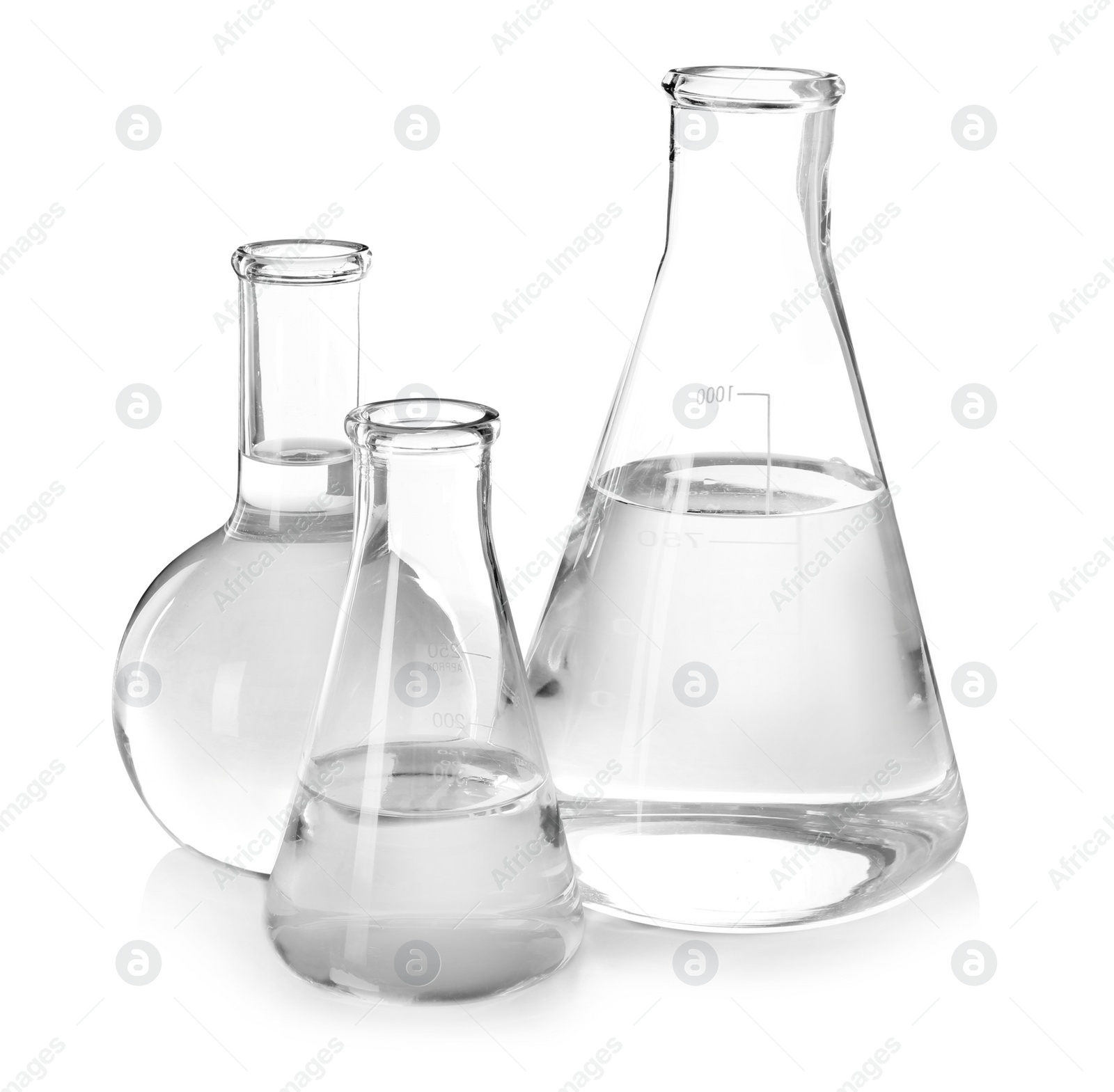 Photo of Flasks with liquid on white background. Laboratory analysis equipment