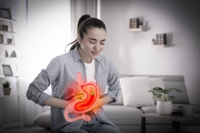 Image of Woman suffering from heartburn at home. Stomach with hot chili pepper symbolizing acid indigestion, illustration