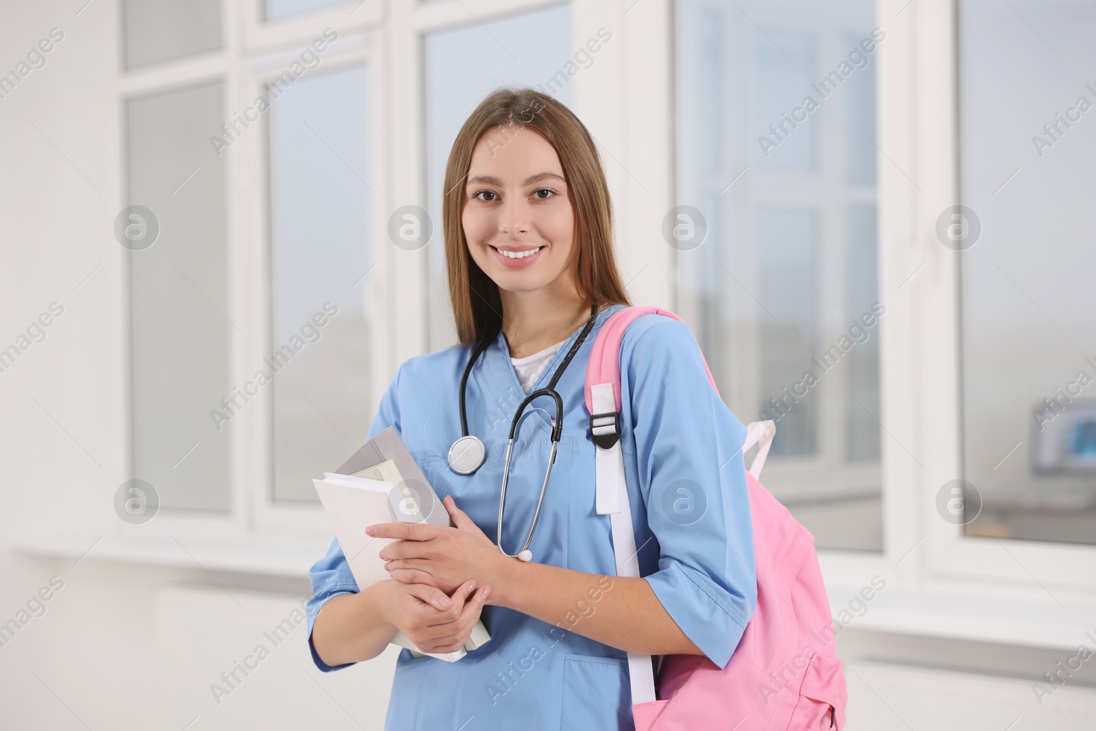 Photo of Portrait of young intern wearing uniform in university hall