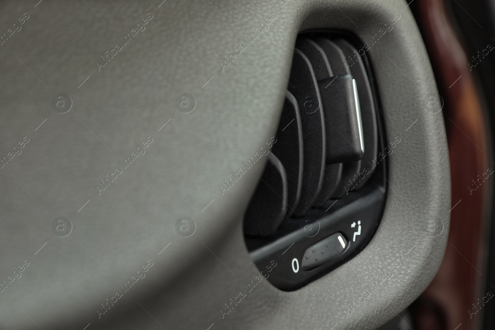 Photo of Air conditioner system in modern car, closeup