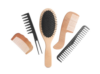 Photo of Set of professional hair combs and brush isolated on white, top view