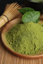 Green matcha powder on bamboo mat, closeup