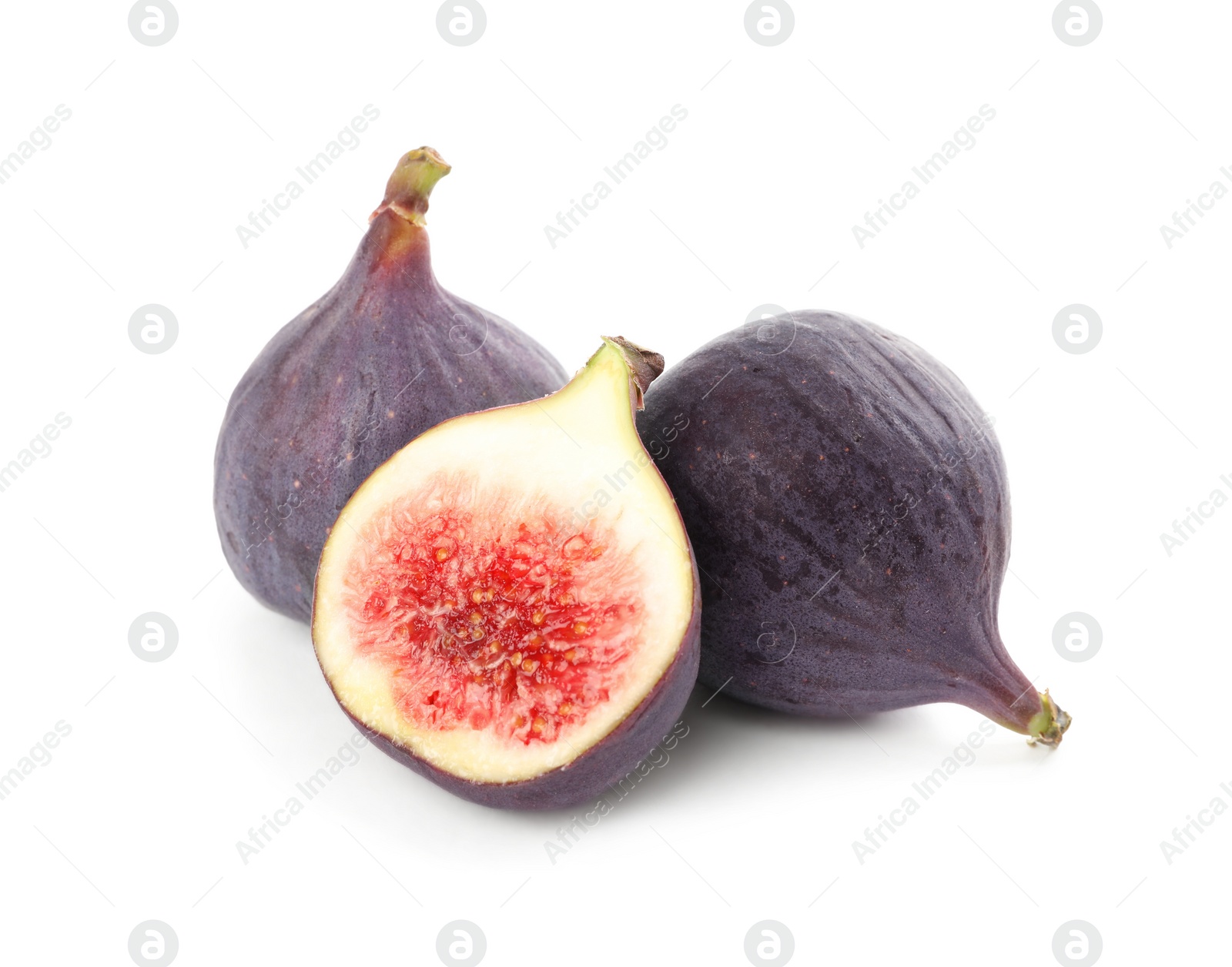 Photo of Whole and cut tasty fresh figs isolated on white