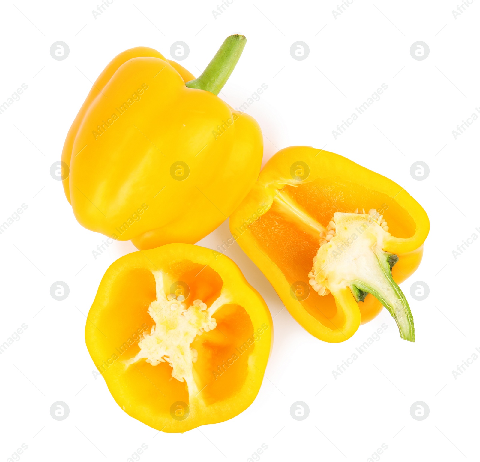 Photo of Whole and cut yellow bell peppers isolated on white, top view