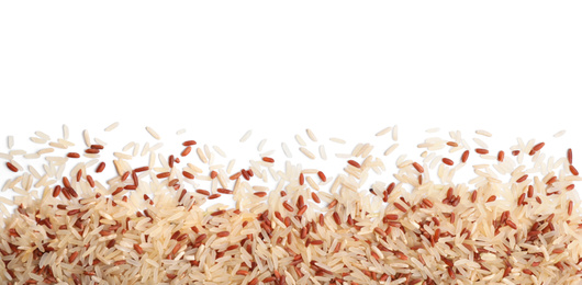 Photo of Mix of brown and polished rice on white background, top view