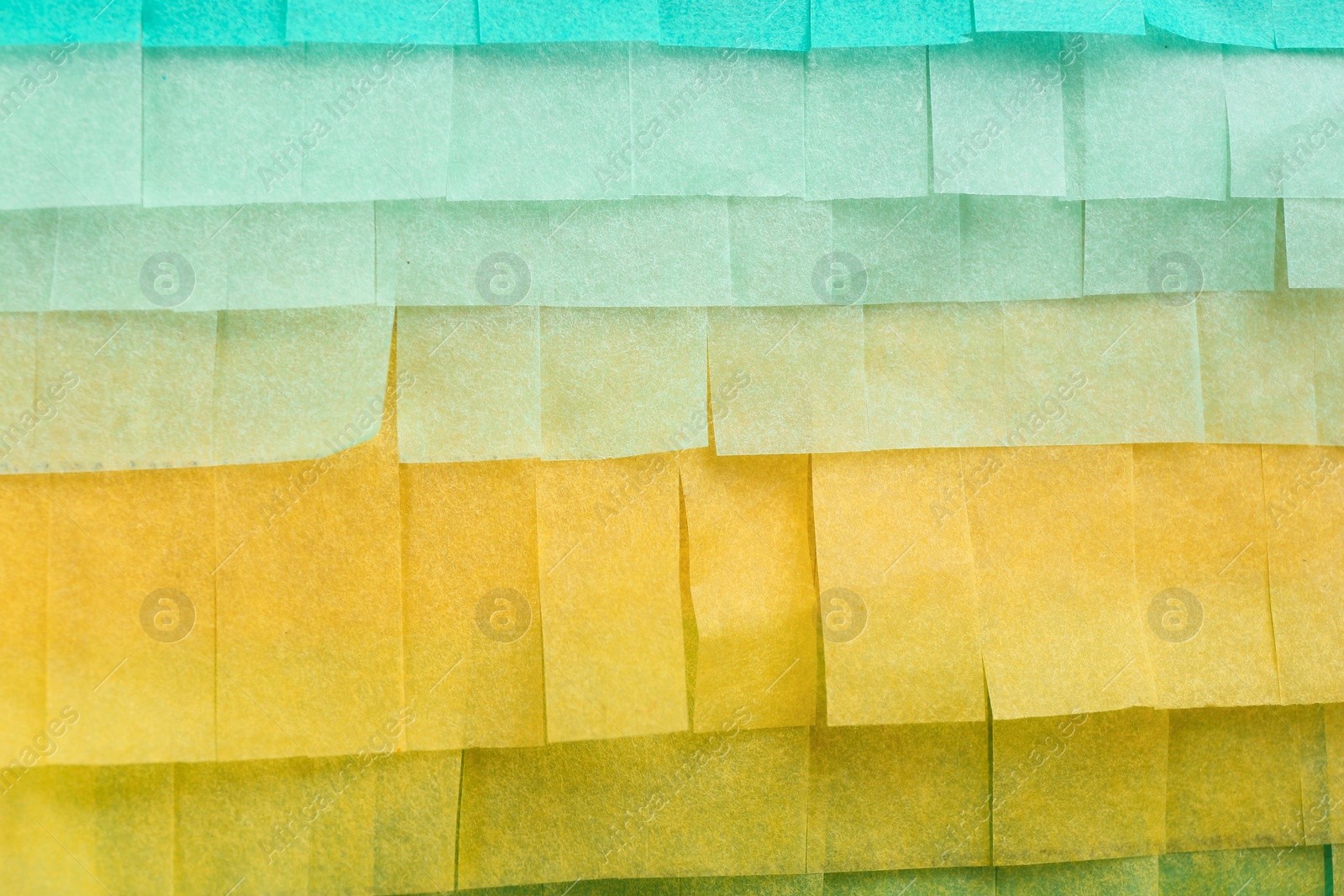 Photo of Cut tissue paper in different colors as background