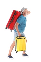 Senior man with suitcases on white background. Vacation travel