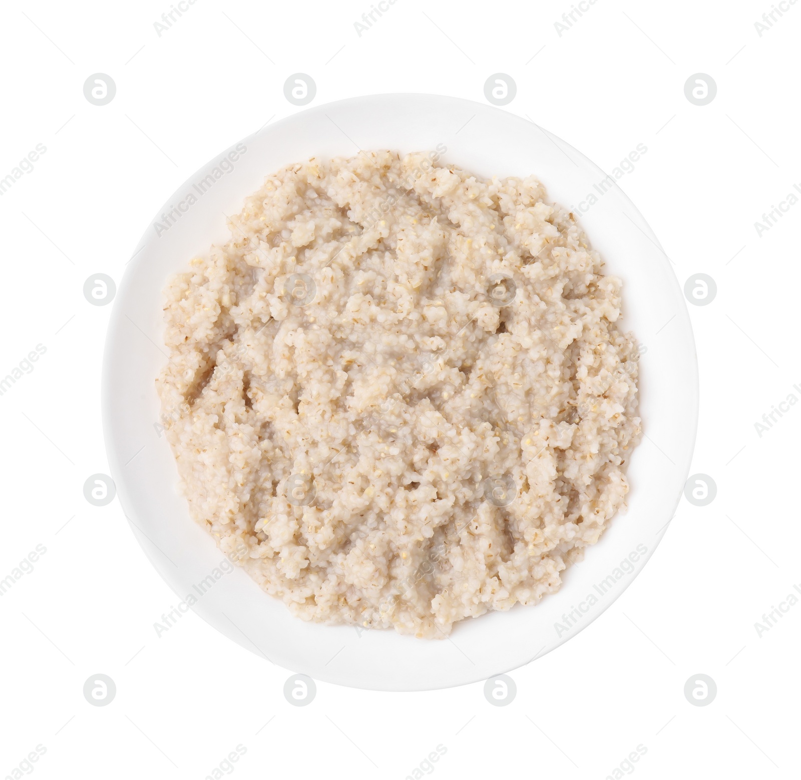 Photo of Delicious barley porridge in bowl isolated on white, top view