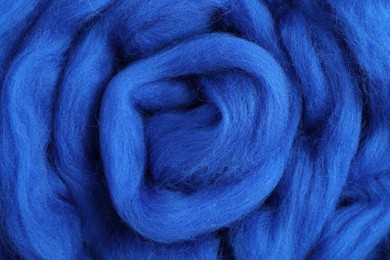 Blue felting wool as background, closeup view