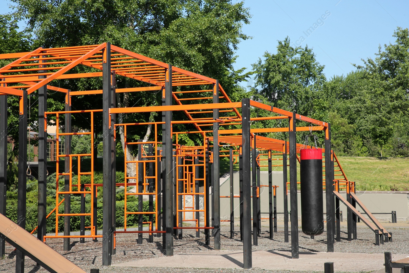 Photo of Empty outdoor gym with exercise equipment in park