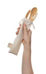 Photo of Woman holding eco friendly cutlery on white background, closeup. Conscious consumption