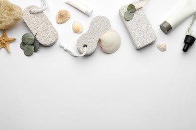 Flat lay composition with pumice stones on light background. Space for text