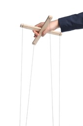 Photo of Businesswoman holding puppet control bar with strings on white background, closeup